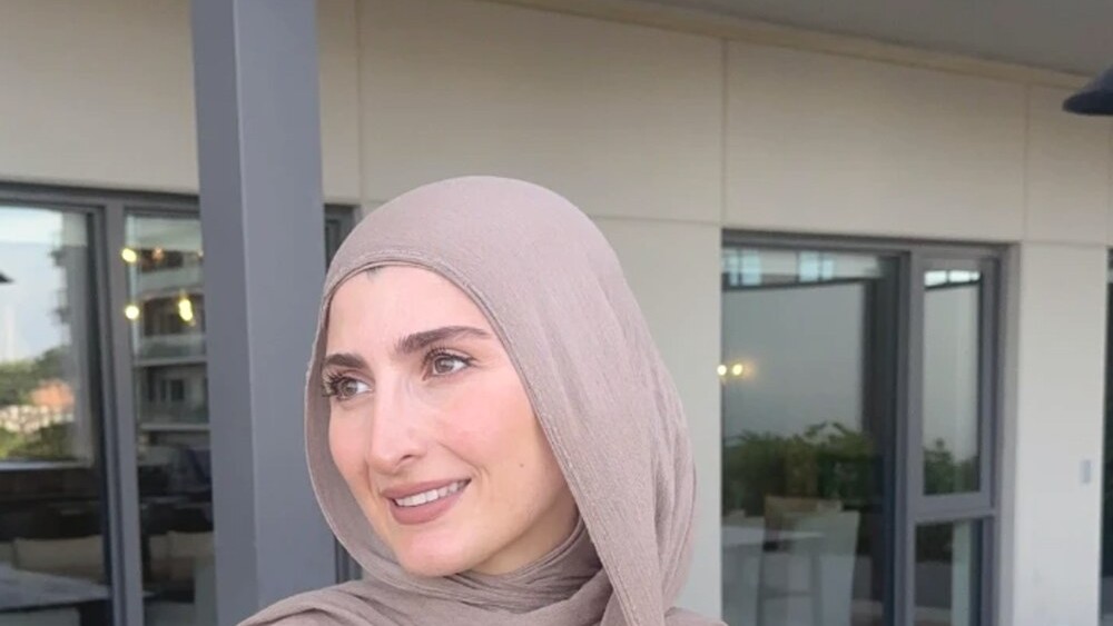 Lujain, founder of LU Wellness, smiling in warm natural light